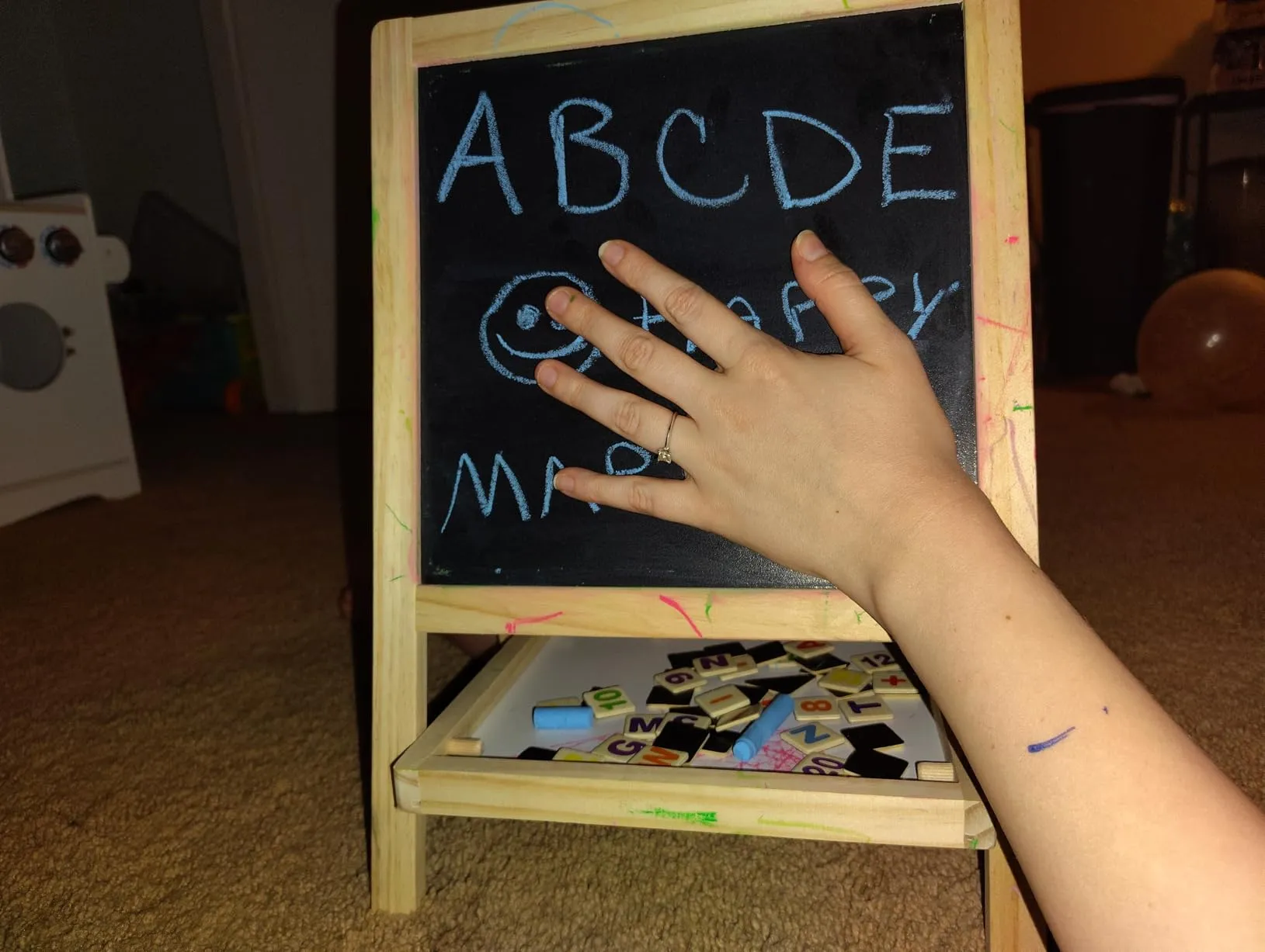 ABCDE and smiley face on chalkboard